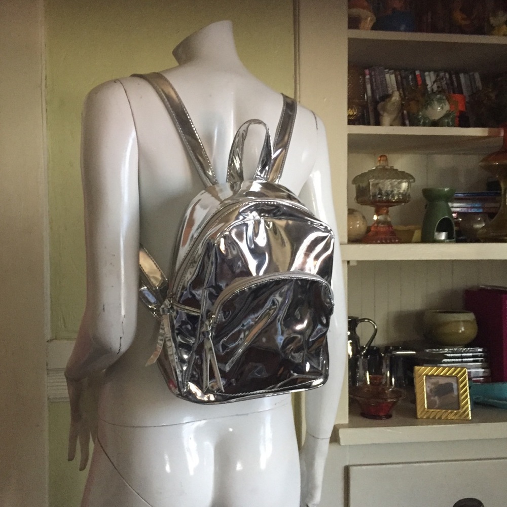 Under One Sky silver backpack